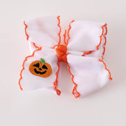 Orange Jack-O-Lantern embroidery crochet edge hair bow