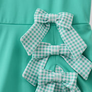 Green scalloped bow active dress