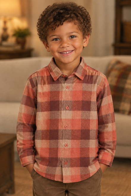 7-year-old biracial boy wearing the rust plaid shirt