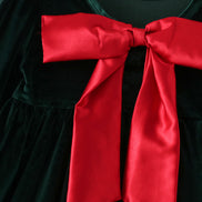 Green velvet bow dress