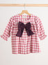 Pink gingham flannel bow dress