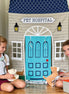 Pet Hospital Doorway Storefront with Vet's Kit