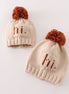Beige pompom hi cable beanie hat
