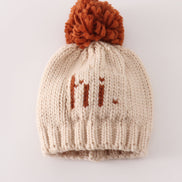 Beige pompom hi cable beanie hat