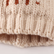 Beige pompom hi cable beanie hat
