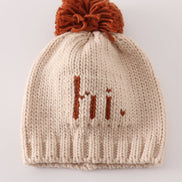 Beige pompom hi cable beanie hat