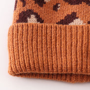 Brown pompom leopard cable beanie hat