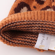 Brown pompom leopard cable beanie hat