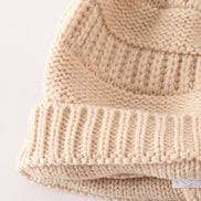 Beige pompom cable beanie hat