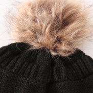 Black pompom cable beanie hat