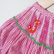 Pink joy hand smocked girl gingham romper