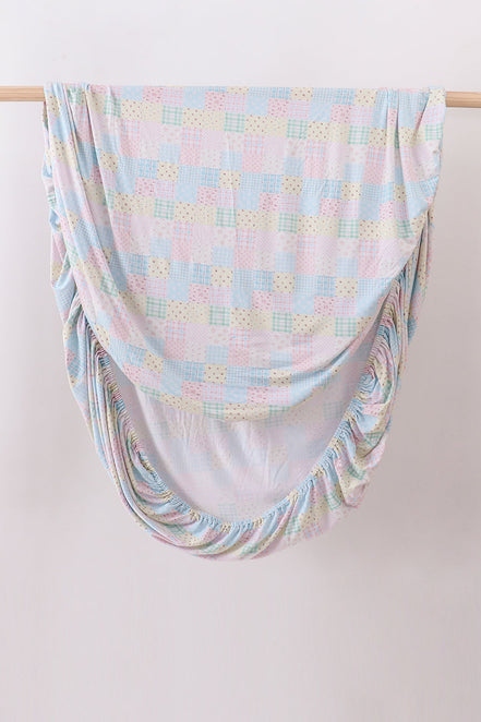 Pink floral checkered bamboo crib sheet