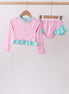 Pink sailboat print ruffle rashguard set