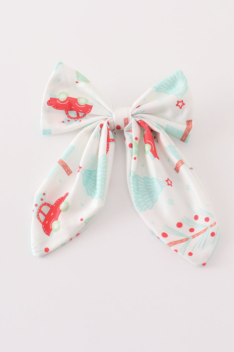 Bow-shaped headband with cartoon designs on a white background