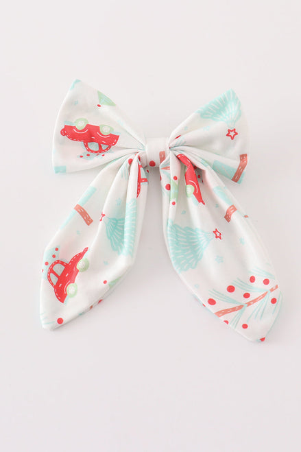 Bow-shaped headband with cartoon designs on a white background